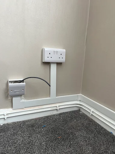 Neatly installed double socket and data point in a Liverpool home