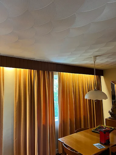 New pendant light fitting installed in a living room